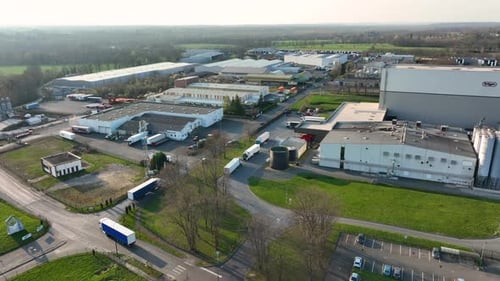 Aerial View of Goods Warehouses and Logistics Center in Industrial City Zone From Above
