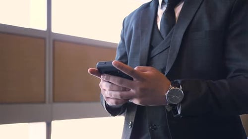 Close Up Businessman in Suit Using Smart Phone 3034 Years
