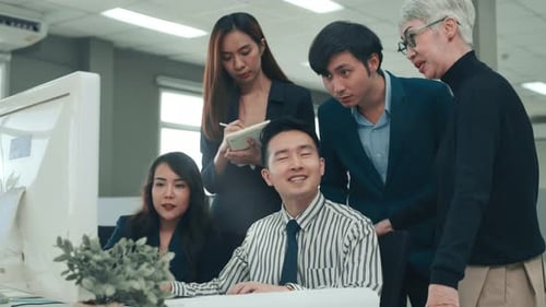 Team of Colleagues Working Together in Office