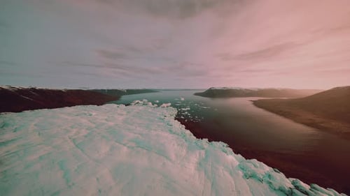 Peaceful Panoramic View of Icy Shoreline During Twilight Hours