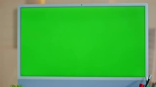 Green Screen Computer Standing on Work Desk Closeup Woman Looking Chroma Key Pc