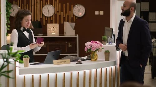 Hotel Receptionist Assists Man With Passport