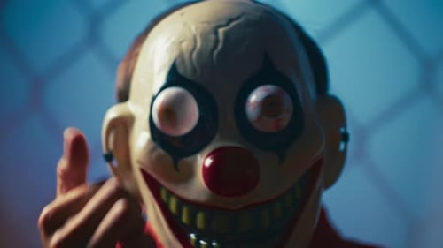 Creepy Clown Mask Profile Shot in Jail Light