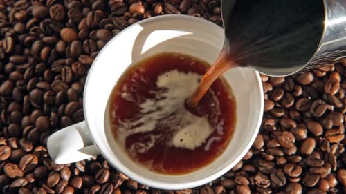 Coffee Pouring into a Mug in Close Up