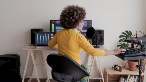 Music, Latin artist mix audio for album in audio software in production studio