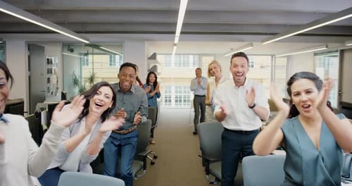 Diverse Employees Applaud in Modern Office Setting