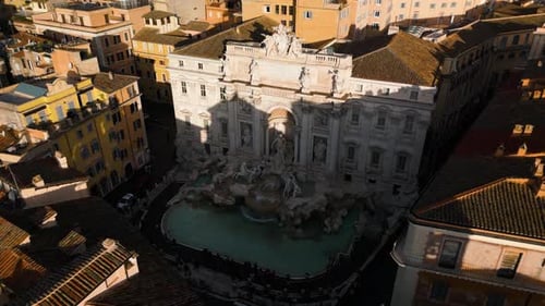 Aerial View of Trevi Fountain (Fontana di Trevi). Cinematic Orbiting Drone Shot