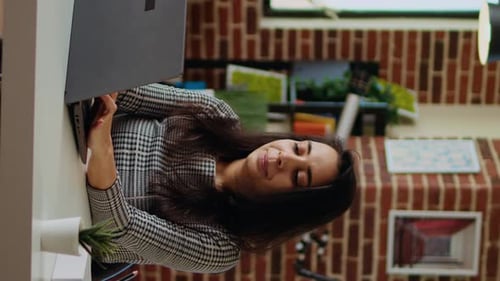 Young Adult Working on Laptop From Home