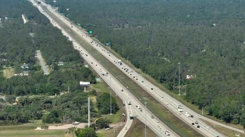 Above View of Wide Highway in Florida with Fast Driving Cars During Rush Hour USA Transportation