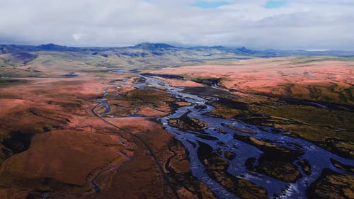 Aerial Braided Glacial River Across Icelandic Highlands Terrain