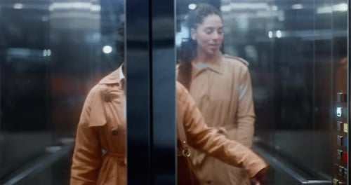 Elevator door, business women and conversation in a office building at company going down