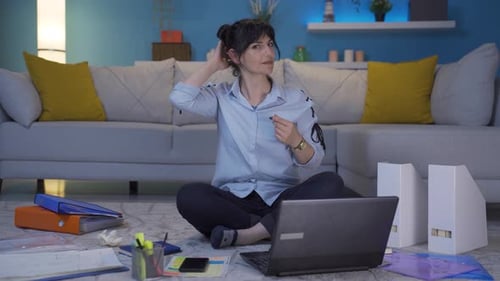 Home office worker woman looks at camera with happy and smiling face.