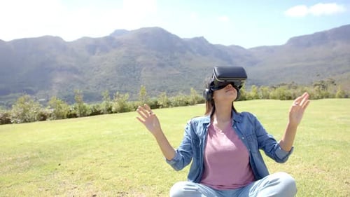 Woman Wearing VR Headset Outdoors in Nature
