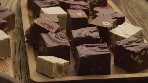 Variety of Handmade Chocolate Fudge on Wooden Tray