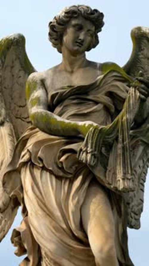 Marble statue of angel on Saint Angel Bridge in Rome, Italy. Vertical