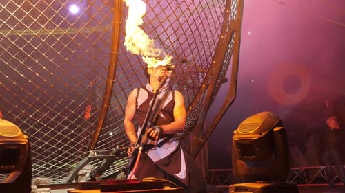 Musician Plays Guitar that Shoots Flames on Stage