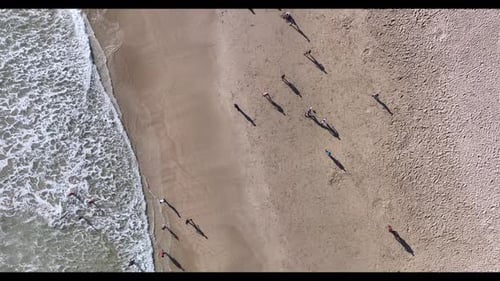High Angle View of People Seen Playing Soccer at the Beach