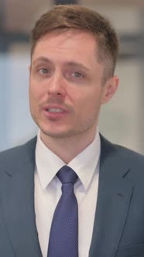 Vertical video, Webcam View of Young Businessman Doing Video Chat