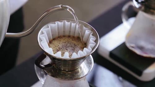 Pouring Hot Water In A Coffee Filter Cup