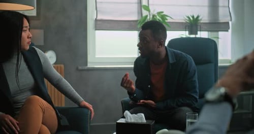 Man Talking to Woman During Counseling Session