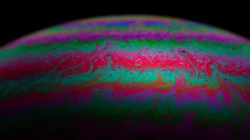 Abstract multicolor art, moving texture inside soap bubble, Slow motion. Science.