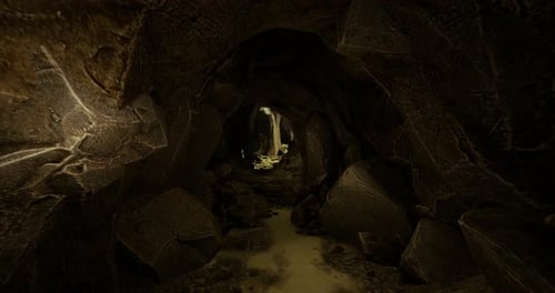 Exploring a Mysterious Underground Cave Filled with Rocks and Shadows