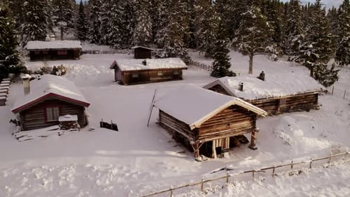 Wooden cabins in Norway. Constructed with whole logs joined with notches.