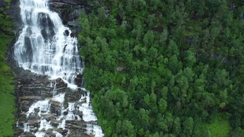 Waterfall in mountains. Outdoor nature in Norway