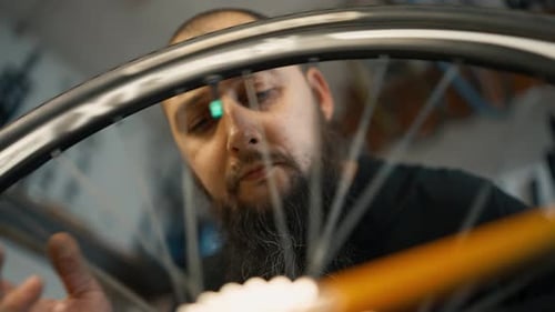 Master Rotates Bicycle Wheel the Chain and Gears to Test Bicycle Slow Motion
