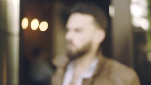 Stylish bearded hipster man with sunglasses portrait in the city street