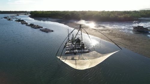 Traditional Fishing Net in Tropical River From Above