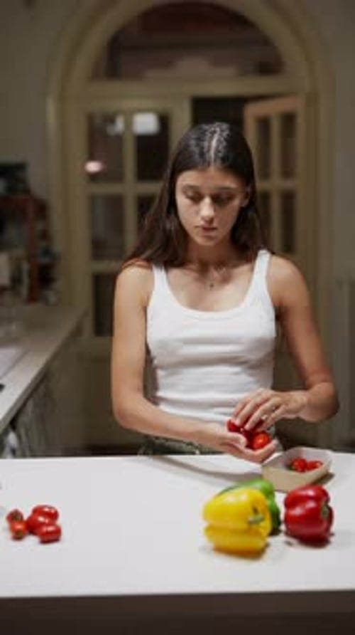 Woman Preparing and Washing Vegetables in the Kitchen