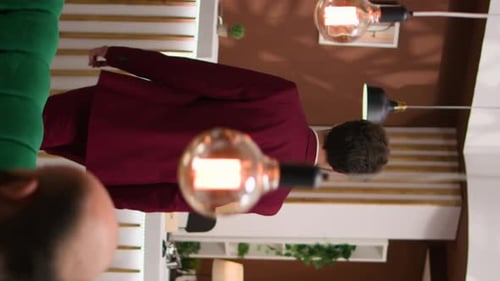 Man Checking Into Hotel Reception