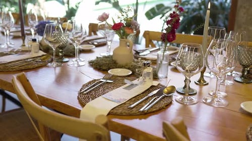 Elegant Wedding Table Setting with Flowers and Candles