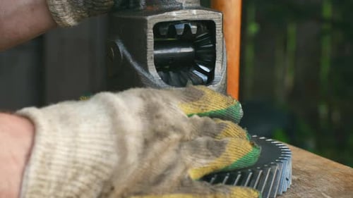 Mechanic Cleaning and Inspecting Car Differential Gear