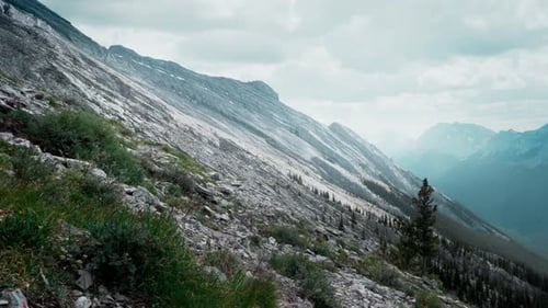 Side of a steep mountain side looking out towards the Canadian Rockies
