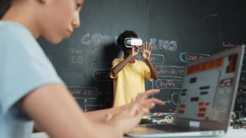 Closeup of school girl hand coding program while student using VR. Edification