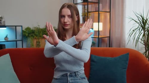 Young Woman Showing Stop Sign, Making X Sign