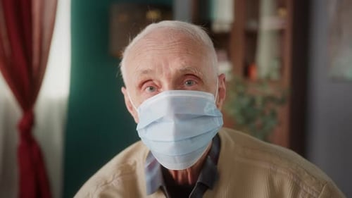 Senior Man Wearing Face Mask Indoors