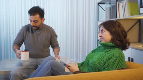 Young Adults Talking in a Living Room