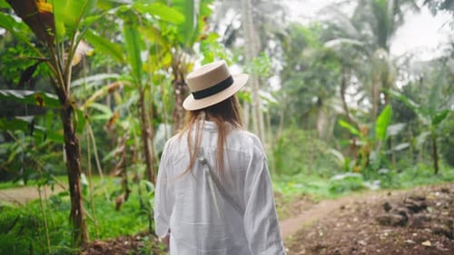 Carefree Blonde Woman in Straw Hat Admire View Mountain Waterfall in Wild Nature Girl Tourist in