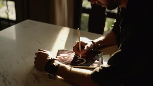 Man Creates Digital Art on Tablet With Stylus