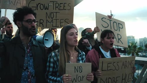 Diverse Group Protests War with Signs and Yelling