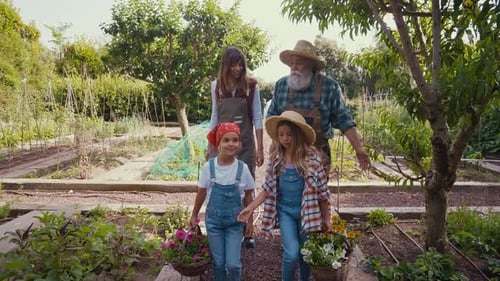 Happy family in a vegetable garden