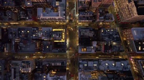 Bird's Eye View of Manhattan Streets in New York Illuminated at Night Showcasing Vibrant City Life