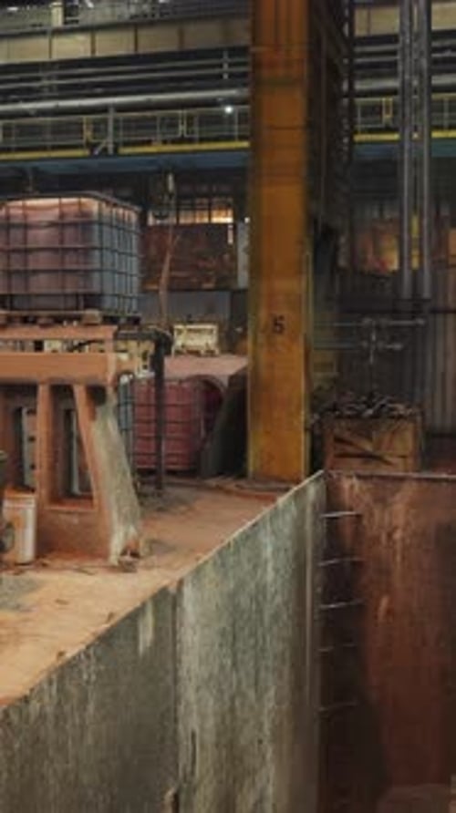 Industrial Crane Lifting Molten Metal in Foundry Stock Clip