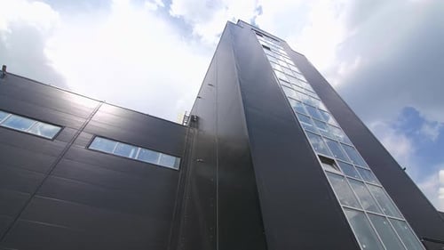 Black Facade with Windows of Large Plant Workshop Closeup