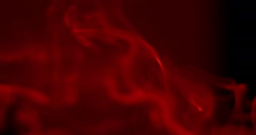 Abstract Red Smoke Drifting on Black Background