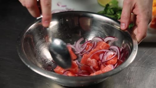 chef prepares a salmon dish in the kitchen. Close-up shots