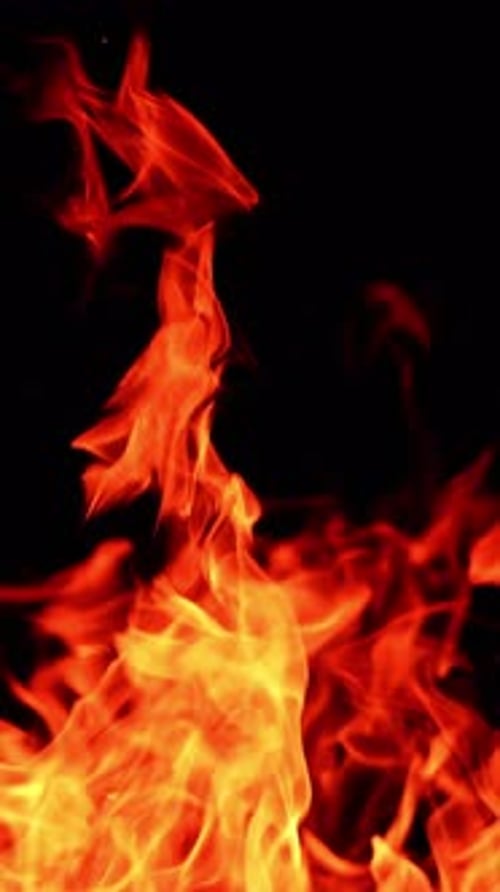 Intense Flames Against Black Background in Portrait Orientation